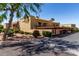 Exterior view of property with carports, landscaping, and palm trees at 16336 E Palisades Blvd # 4, Fountain Hills, AZ 85268