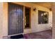 Front entrance featuring security gate and desert landscaping at 16336 E Palisades Blvd # 4, Fountain Hills, AZ 85268