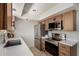 Modern kitchen with stainless steel appliances, white countertops and tile floor at 16336 E Palisades Blvd # 4, Fountain Hills, AZ 85268