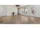 Spacious living room with tiled flooring, natural light, and a ceiling fan at 16336 E Palisades Blvd # 4, Fountain Hills, AZ 85268