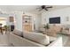 Bright living room with neutral colors, ceiling fan, and modern furniture in a cozy open floor plan at 16336 E Palisades Blvd # 4, Fountain Hills, AZ 85268