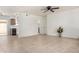 Bright living room with tile floors, ceiling fan, and access to the kitchen at 16336 E Palisades Blvd # 4, Fountain Hills, AZ 85268
