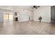 Open-concept living room features tile floors, and sliding glass doors to the outside at 16336 E Palisades Blvd # 4, Fountain Hills, AZ 85268