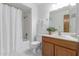 Clean bathroom features a shower-tub combination and a vanity with ample counter space at 1704 E Hackamore St, Mesa, AZ 85203