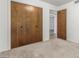 Relaxing bedroom featuring neutral carpeting and closet space at 1704 E Hackamore St, Mesa, AZ 85203