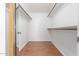 Walk-in closet with shelves and racks for organized storage of clothing and accessories at 1704 E Hackamore St, Mesa, AZ 85203