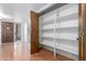 Entryway features wooden floors, convenient coat closet, and bright light at 1704 E Hackamore St, Mesa, AZ 85203