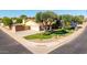 Charming house on a corner lot with mature trees and well-maintained landscaping at 1704 E Hackamore St, Mesa, AZ 85203