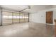 Large garage featuring an automatic door and a convenient side door at 1704 E Hackamore St, Mesa, AZ 85203