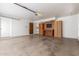 Spacious garage with ample storage, workbench, and easy access to the home at 1704 E Hackamore St, Mesa, AZ 85203