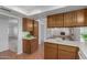 An open kitchen and breakfast bar overlooking the spacious living room at 1704 E Hackamore St, Mesa, AZ 85203