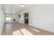 Bright sunroom with tile flooring, sliding doors, and view to the kitchen at 1704 E Hackamore St, Mesa, AZ 85203