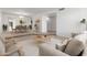 Staged living room featuring neutral tones, a comfortable sofa, and stylish decor at 1704 E Hackamore St, Mesa, AZ 85203