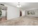 A bright living room with carpeted floors and large windows at 1704 E Hackamore St, Mesa, AZ 85203