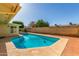 Backyard in-ground pool with brick pavers surrounding the outside edges at 1704 E Hackamore St, Mesa, AZ 85203