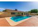 Backyard in-ground pool with brick pavers surrounding the outside edges at 1704 E Hackamore St, Mesa, AZ 85203