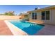 Sparkling pool surrounded by a brick and concrete deck in a private backyard at 1704 E Hackamore St, Mesa, AZ 85203