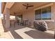 Comfortable covered back porch with ceiling fans and a full outdoor kitchen at 1736 E Joelle Dr, Casa Grande, AZ 85122