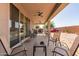 Covered patio with comfortable seating and fans for relaxation at 1736 E Joelle Dr, Casa Grande, AZ 85122