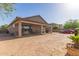 View of the spacious backyard featuring a large covered patio with an outdoor kitchen at 1736 E Joelle Dr, Casa Grande, AZ 85122