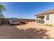 Backyard view featuring classic car parking with patio at 1736 E Joelle Dr, Casa Grande, AZ 85122