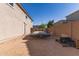 Backyard view with parking spot behind an iron gate at 1736 E Joelle Dr, Casa Grande, AZ 85122