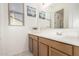 Bright bathroom featuring a vanity with double sinks and a large mirror at 1736 E Joelle Dr, Casa Grande, AZ 85122