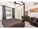 Bedroom with natural light, ceiling fan, a four poster bed, and decorative rug at 1736 E Joelle Dr, Casa Grande, AZ 85122