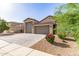 Charming single-story home with a three-car garage and well-maintained desert landscaping at 1736 E Joelle Dr, Casa Grande, AZ 85122