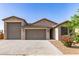 Charming single-story home with a three-car garage and well-maintained desert landscaping at 1736 E Joelle Dr, Casa Grande, AZ 85122