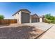 Charming single-story home with a three-car garage, private entrance, and fenced in yard at 1736 E Joelle Dr, Casa Grande, AZ 85122