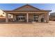 Inviting covered patio featuring an outdoor dining area, perfect for relaxing and entertaining at 1736 E Joelle Dr, Casa Grande, AZ 85122