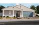 Charming single-story home with a two-car garage and a landscaped front yard featuring desert plants at 17670 W Mariposa Dr, Goodyear, AZ 85395