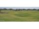 Vast green space area with well-kept grass and a gazebo, ideal for community events and leisurely strolls at 17679 W Mariposa Dr, Goodyear, AZ 85395