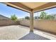 Covered patio with brick pavers and a block wall ensures privacy at 17789 W Bridger St, Surprise, AZ 85388