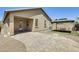 Backyard featuring a paved patio, gravel accents, and a covered gazebo with outdoor seating at 17789 W Bridger St, Surprise, AZ 85388