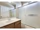 Bathroom featuring frosted glass shower door and a single sink vanity at 17789 W Bridger St, Surprise, AZ 85388
