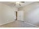 Bedroom with carpet, double closet, and a view into the bathroom at 17789 W Bridger St, Surprise, AZ 85388