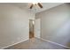 Inviting bedroom with carpet floors, neutral walls, ceiling fan and an access doorway at 17789 W Bridger St, Surprise, AZ 85388