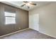 Bedroom featuring carpet floors, neutral walls, closet and a window providing natural light at 17789 W Bridger St, Surprise, AZ 85388