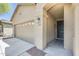 Inviting home exterior featuring a covered entrance, a two-car garage, and desert landscaping at 17789 W Bridger St, Surprise, AZ 85388
