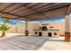 A covered patio featuring an outdoor oven at 1852 N Grand St, Mesa, AZ 85201