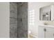 Beautiful bathroom with a tiled shower and a white vanity offers style and comfort at 1852 N Grand St, Mesa, AZ 85201