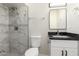 Modern bathroom with marble shower, updated fixtures, and white vanity at 1852 N Grand St, Mesa, AZ 85201