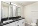 Double sink bathroom with granite countertop, large mirrors and updated fixtures at 1852 N Grand St, Mesa, AZ 85201