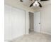 This bedroom features tile flooring, neutral walls and a closet with sliding doors at 1852 N Grand St, Mesa, AZ 85201