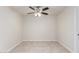 This bedroom features neutral walls, tile flooring and a ceiling fan with light fixture at 1852 N Grand St, Mesa, AZ 85201