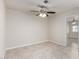 Neutral bedroom with tiled floors and a ceiling fan provides a serene ambiance at 1852 N Grand St, Mesa, AZ 85201