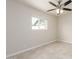This bedroom features neutral walls, tile flooring and a window at 1852 N Grand St, Mesa, AZ 85201
