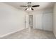 This bedroom features neutral walls, tile flooring and a closet with sliding doors at 1852 N Grand St, Mesa, AZ 85201